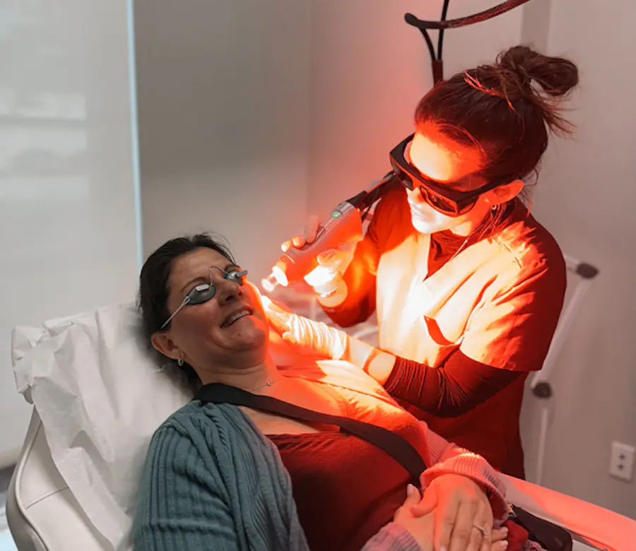 Patient receiving a facial laser skin treatment at Refresh - Aesthetics & Wellness in Florida Patient receiving a facial laser skin treatment at Refresh - Aesthetics & Wellness in Florida
