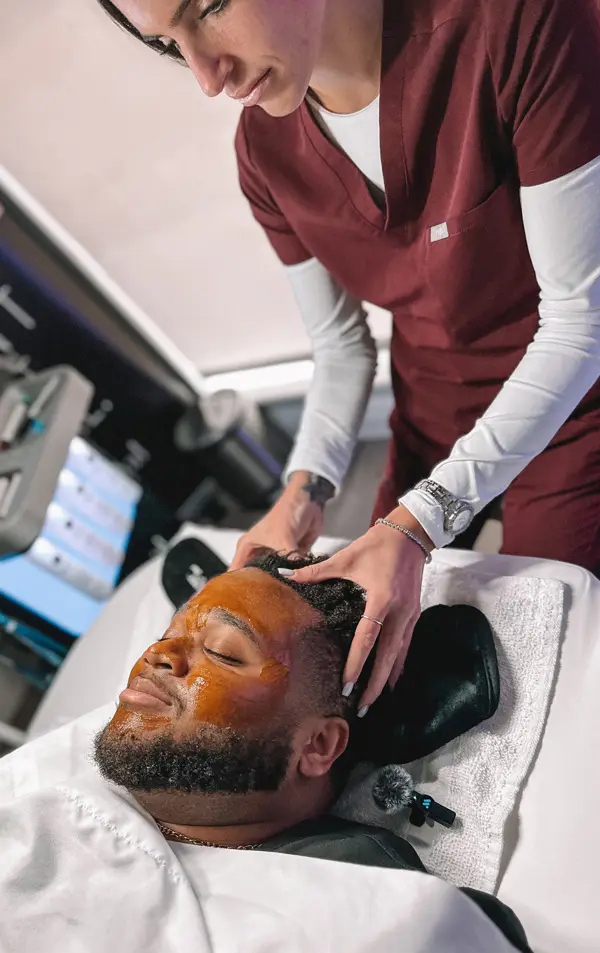 Male patient receiving a chemical peel facial treatment at Refresh - Aesthetics & Wellness