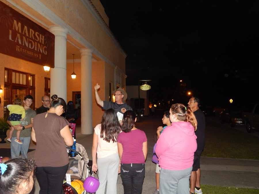Larry giving talk in front of Marsh Landing Restaurant