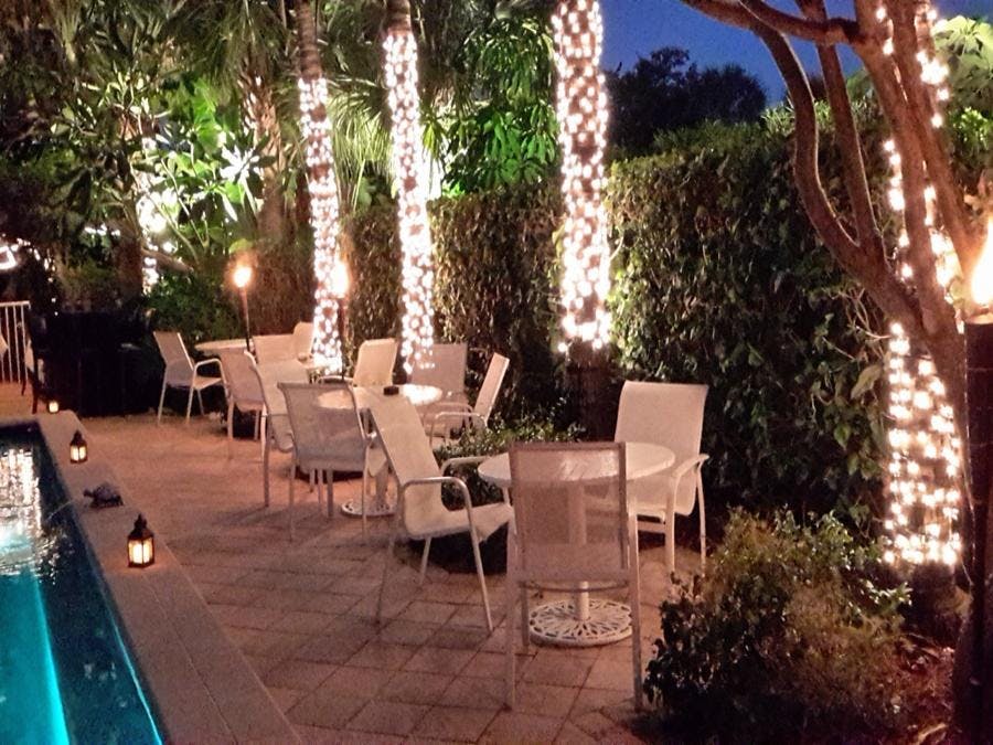 The Caribbean Court Boutique Hotel outdoor patio by the pool