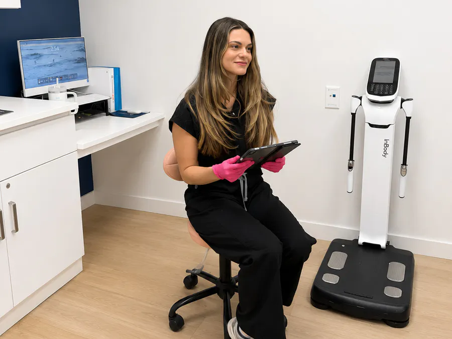 A Refresh medical provider consulting with a patient about the treatment plan in a private consultation room in Vero Beach, Florida.