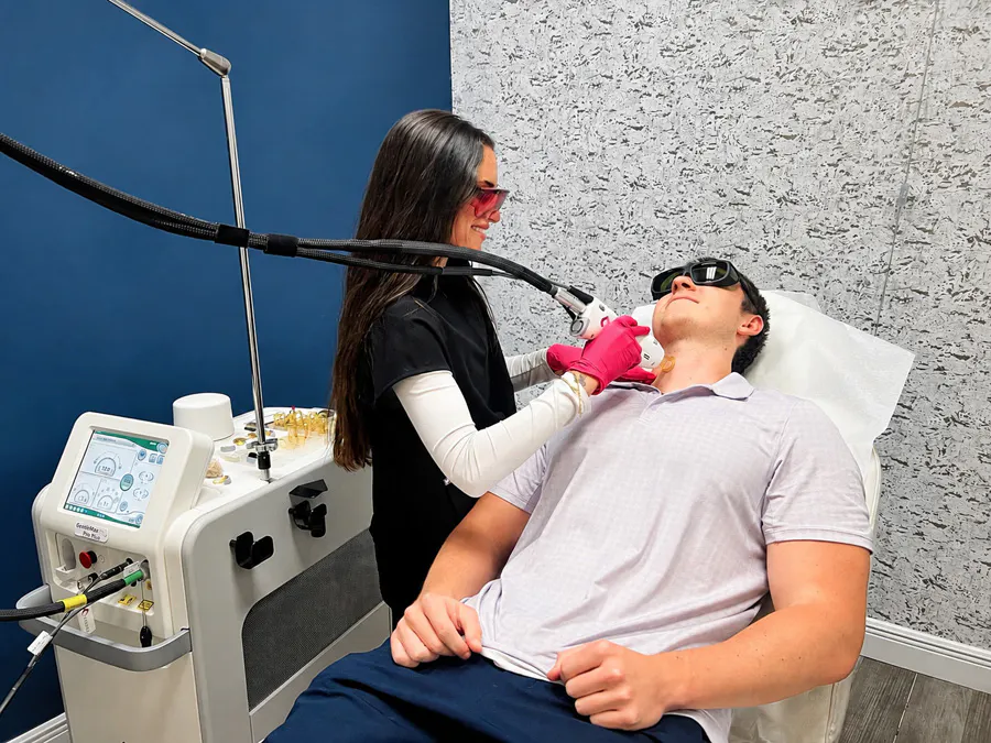 A Refresh provider performing laser hair removal with settings prescribed for the patient's skin type in Vero Beach.