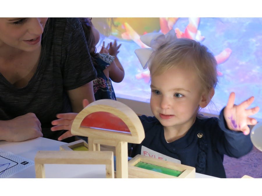 Mother and child playing with blocks
