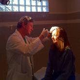 Dr. John McDonald doing an exam on a patient Dr. John McDonald doing an exam on a patient