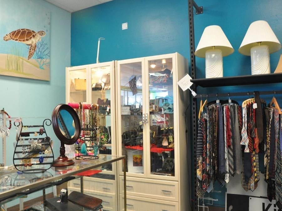 Miscellaneous jewelry, lamps and men's ties on display 