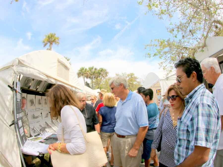 People looking at artwork at art festival