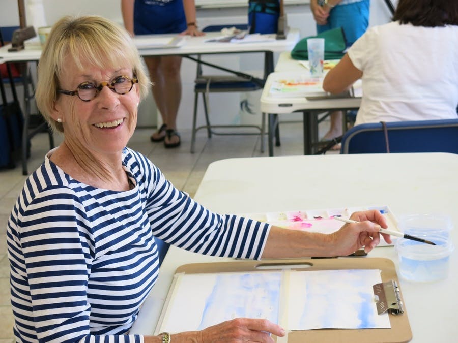 Woman student drawing at art class