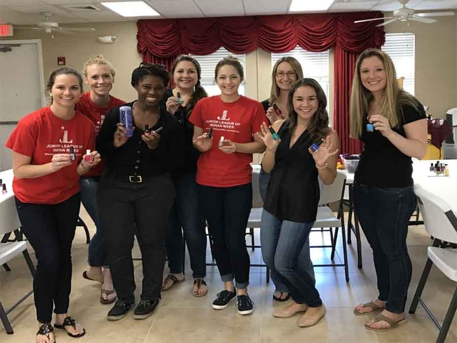 Junior league posing at the Village