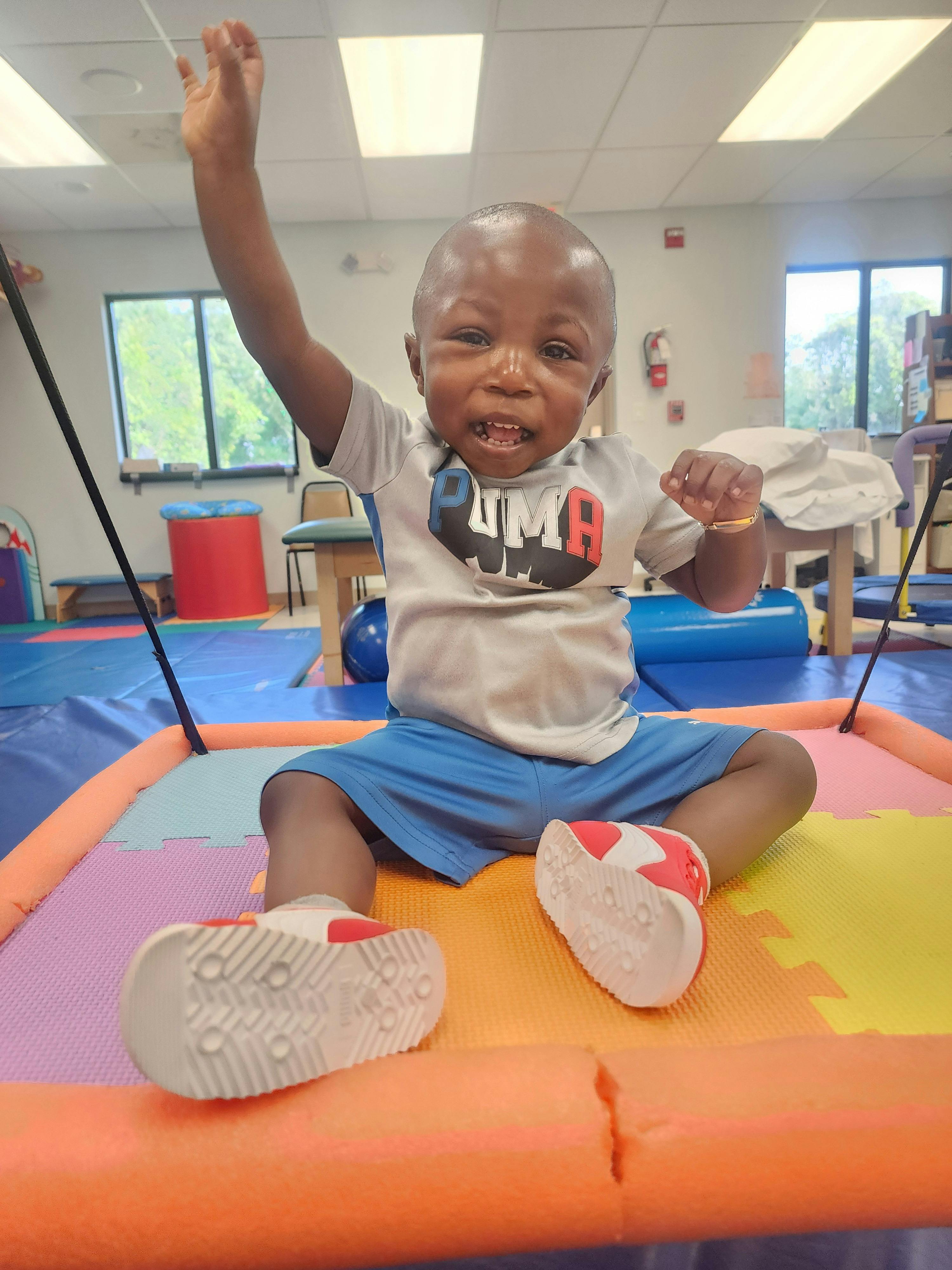 Little boy raising his hand