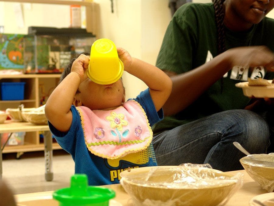 child drinking out of sippy cup