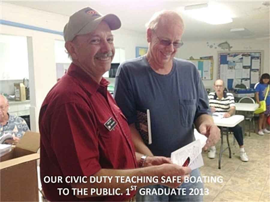 Man reviewing boat safety with another man