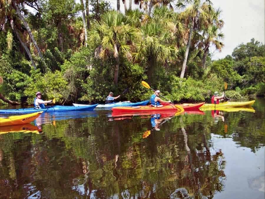 group kayaking in the river