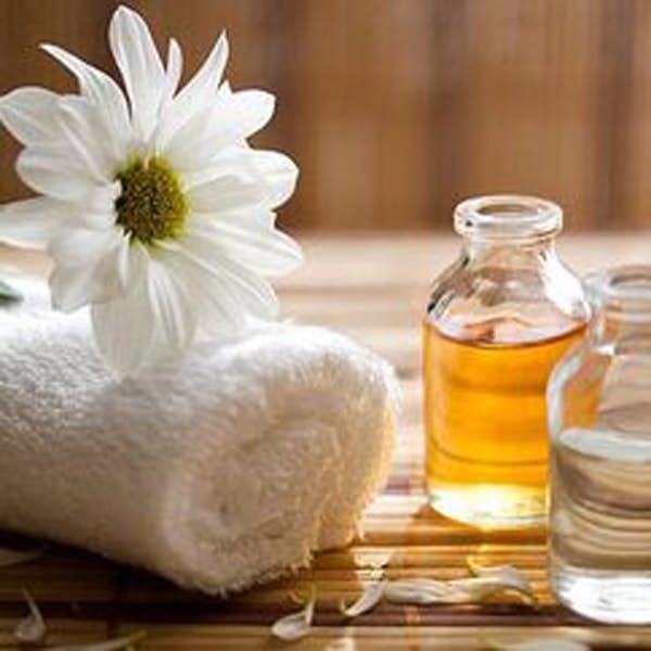 towel and oil for massage